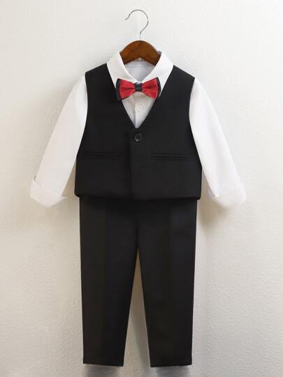 小男童前蝴蝶結襯衫和夾克背心和褲子