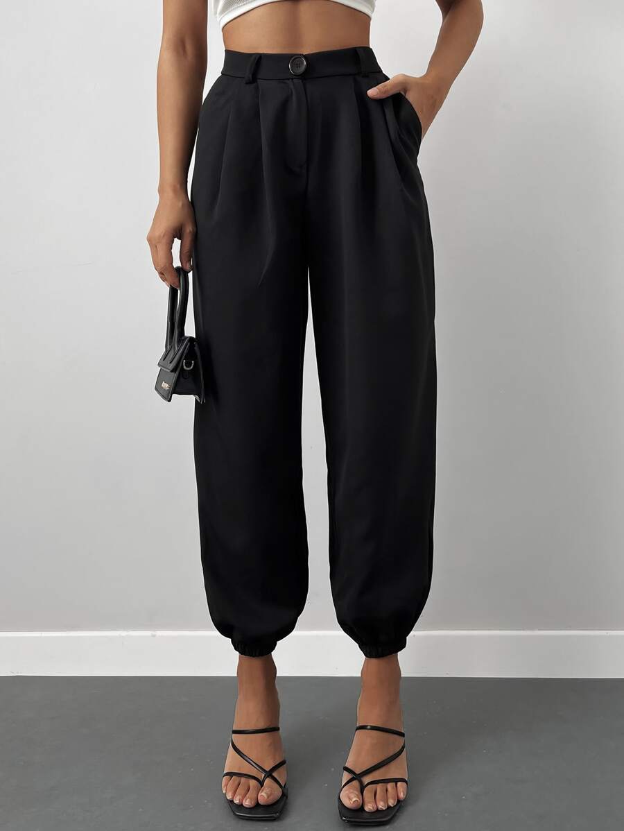 Pantalones jogger unicolor con bolsillo oblicuo - Negro - Ver 1