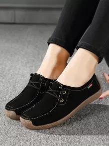 Zapatillas planas con cordón delantero