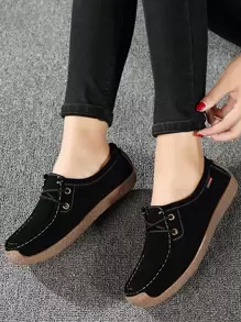 Zapatillas planas con cordón delantero