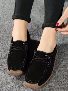 Zapatillas planas con cordón delantero