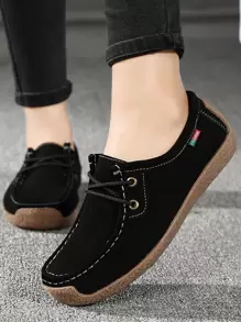 Zapatillas planas con cordón delantero