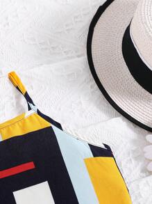 女孩幾何印花吊帶上衣和前蝴蝶結高低下擺半身裙