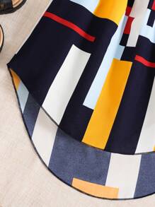 女孩幾何印花吊帶上衣和前蝴蝶結高低下擺半身裙