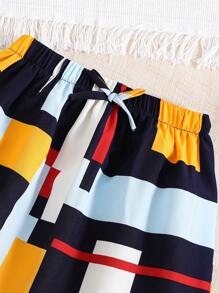 女孩幾何印花吊帶上衣和前蝴蝶結高低下擺半身裙