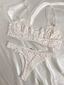 Abitino intimo con reggiseno a ferretto e mutandine in contrasto con stampa floreale disordinata e pizzo