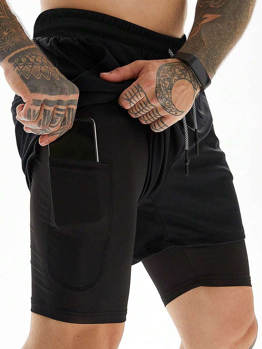 Manfinity Sport Corelite Pantalones cortos deportivos de 2 en 1 con bolsillo para teléfono, cintura con cordón, bucle para toalla, elásticos, estilo novio, pantalones cortos de gimnasio, pantalones de chándal, color negro - Negro - Ver 1
