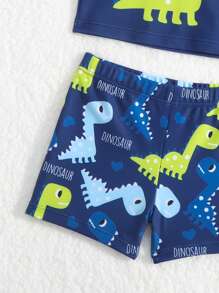 Baby Boy Dinosaur Printed Swimsuit Set, Top With Printed Pattern / Bottom With Random Pattern, With Swimming Cap