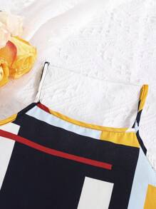 女孩幾何印花吊帶上衣和前蝴蝶結高低下擺半身裙