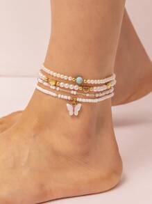 Set de 4 piezas de tobilleras para niñas con perlas cultivadas, perlas de semilla, y diseños de mariposa y corazón - Multicolor - Ver 1