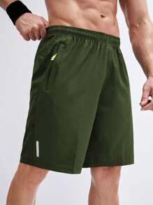 Manfinity Sport Corelite Hombres Shorts deportivos con bolsillo con cremallera - Verde militar - Ver 1