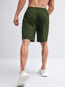 Manfinity Sport Corelite Hombres Shorts deportivos con bolsillo con cremallera - Verde militar - Ver 2