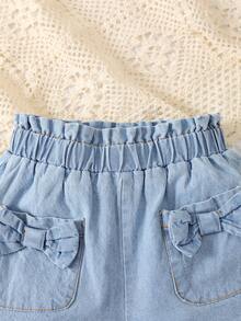 小女童紙袋腰前蝴蝶結雙口袋牛仔短褲