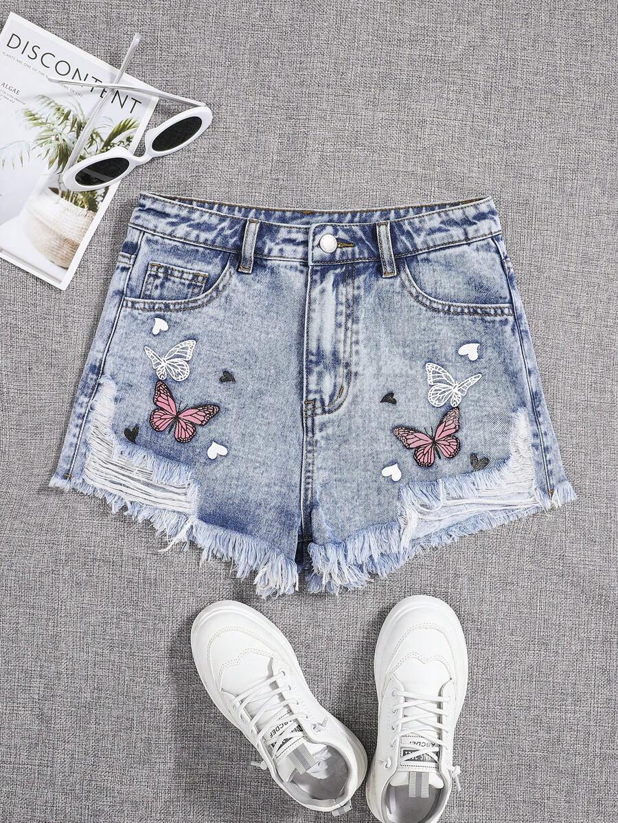SHEIN Chicas adolescentes Shorts mezclilla desgarro bajo crudo con estampado de mariposa - Lavado ligero - Ver 1