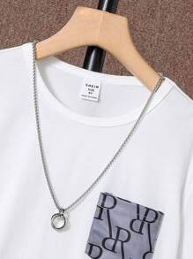 SHEIN Camiseta Con Ribete En Contraste Y Pantalones Cortos Estampados Para Niño Adolescente