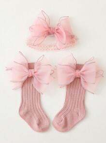 1雙女孩蝴蝶結裝飾長筒襪和1入組髮帶