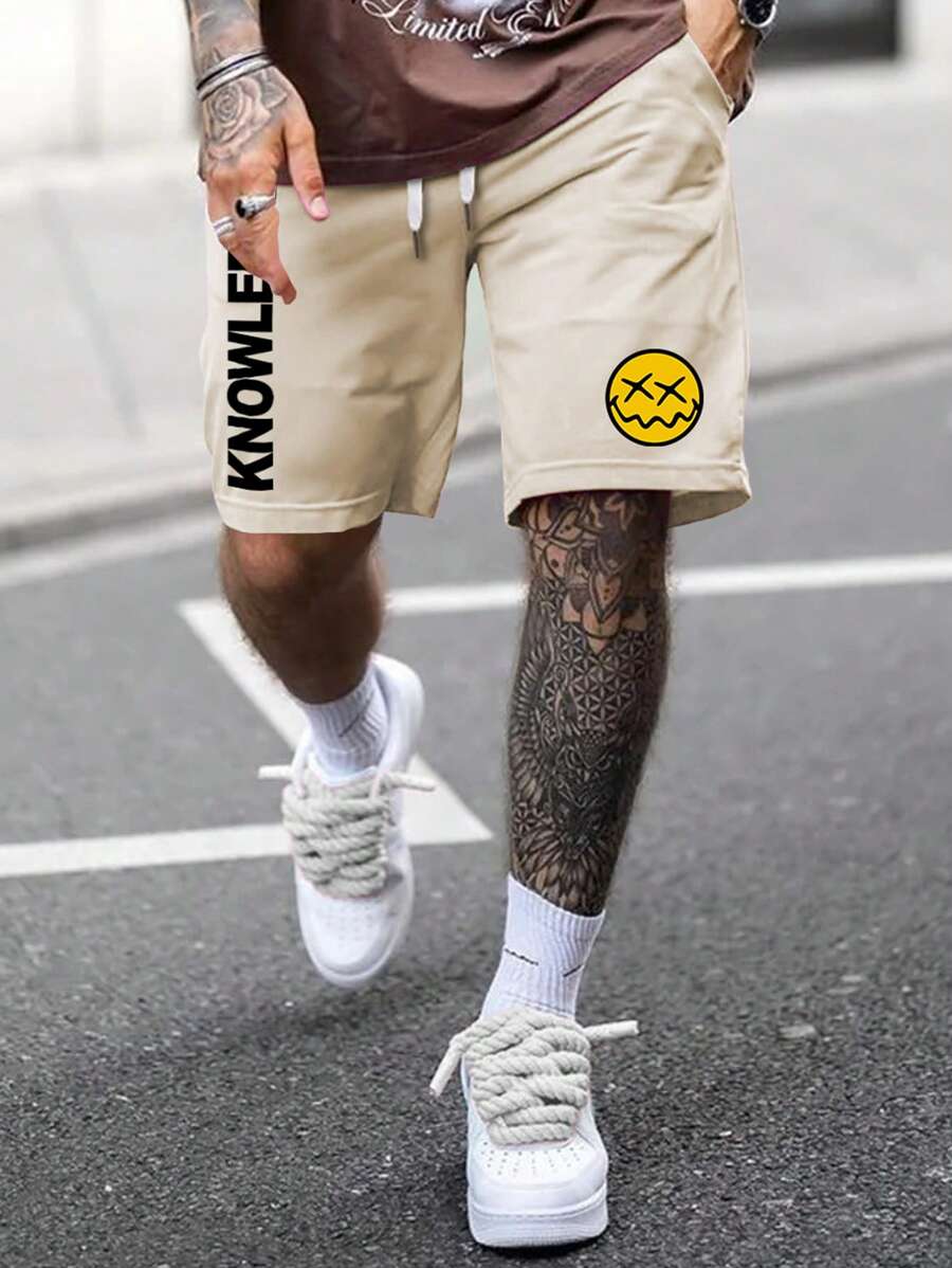 Manfinity EMRG 寬鬆男士卡通和字母圖案印花短褲,帶拉繩腰帶