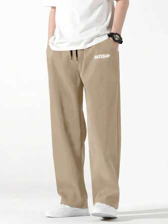 بنطلون رجالي رسالة جرافيك بخصر يربط برباط وساقين مستقيمتين واسعة