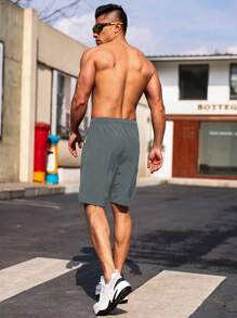 Manfinity Sport Corelite Pantaloncini casual da uomo stile boyfriend con coulisse in vita, tasche con cerniera, pantaloncini da allenamento, pantaloncini grigi da palestra