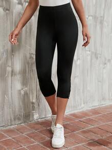EMERY ROSE Leggings con tira cruzada bajo capri