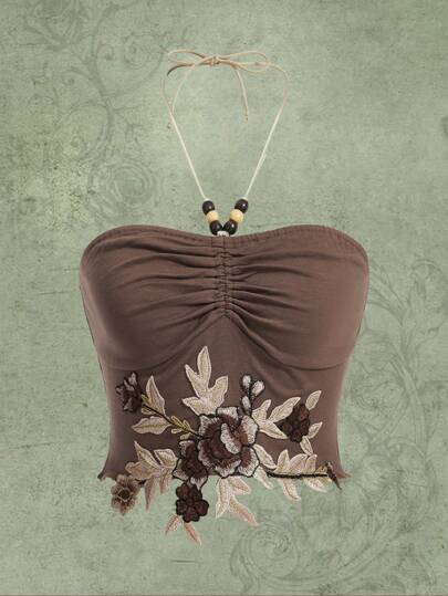 Top halter con bordado floral fruncido