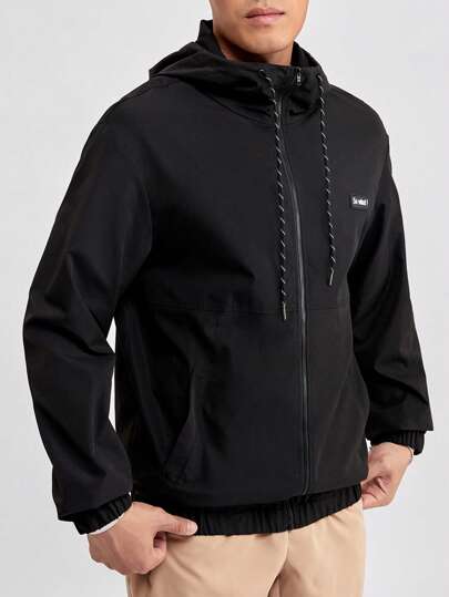 Manfinity RebelGame Chaqueta con capucha con cordón y parche con eslogan, de corte holgado para hombre, para otoño e invierno