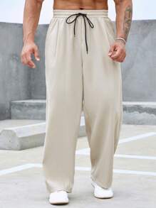 Manfinity Homme 男士寬鬆直筒長褲,採用字母補丁細節設計和束口腰帶 - 米色 - 查看 3