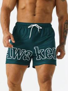 Street Sport Men Letter Graphic Drawstring Waist Slant Pocket Shorts