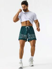 Street Sport Men Letter Graphic Drawstring Waist Slant Pocket Shorts