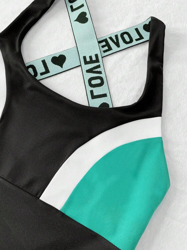 Yoga Futuristic Mono deportivo de color combinado con cinta con letra con tira cruzada de espalda abierta - Multicolor - Añade 7