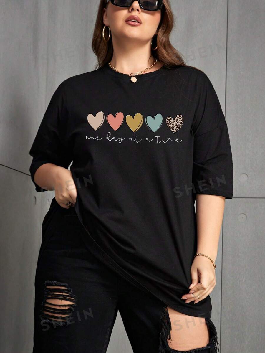 INAWLY Camiseta de manga caída con gráficos de corazón y lema, top de verano para mujer, "Un día a la vez" - Negro - Ver 1