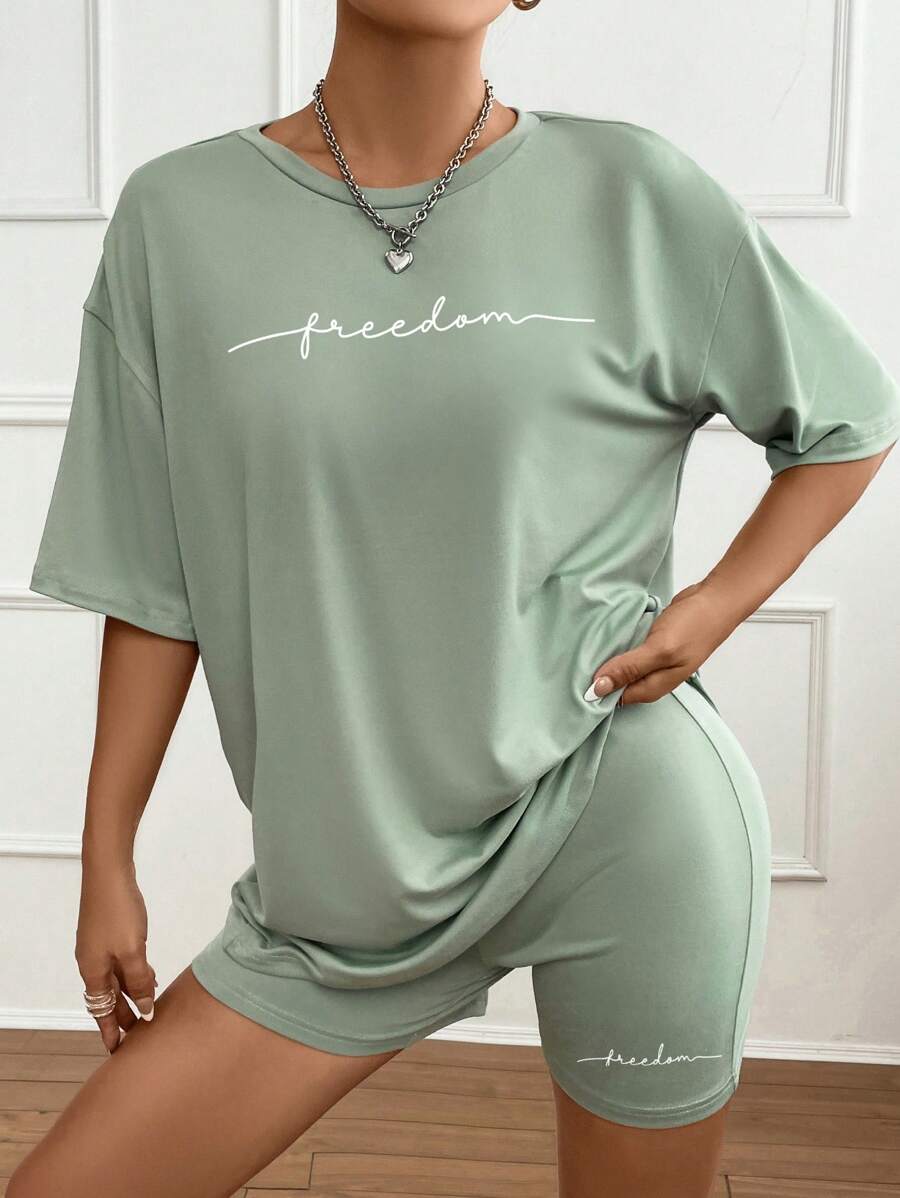 SHEIN Unity Bộ 2 món áo thun cổ tròn tay ngắn in chữ và quần short bó thường ngày cho nữ - Màu xanh Bạc hà - Xem 1