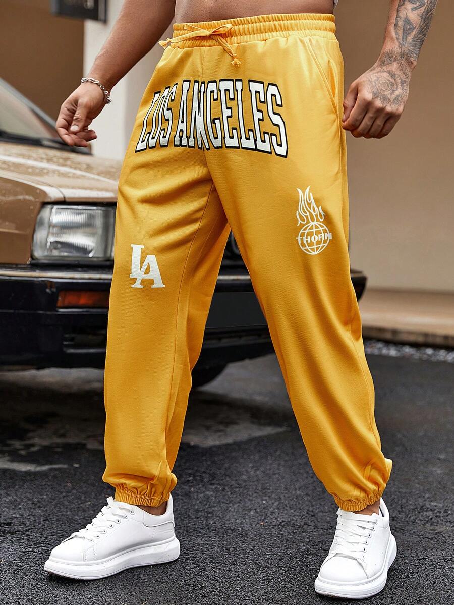 Manfinity EMRG Pantalones De Chándal Sueltos De Cintura Con Cordón Y Letras Gráficas Para Hombres - Amarillo - Ver 1