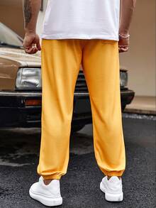 Manfinity EMRG Pantalones De Chándal Sueltos De Cintura Con Cordón Y Letras Gráficas Para Hombres - Amarillo - Ver 2