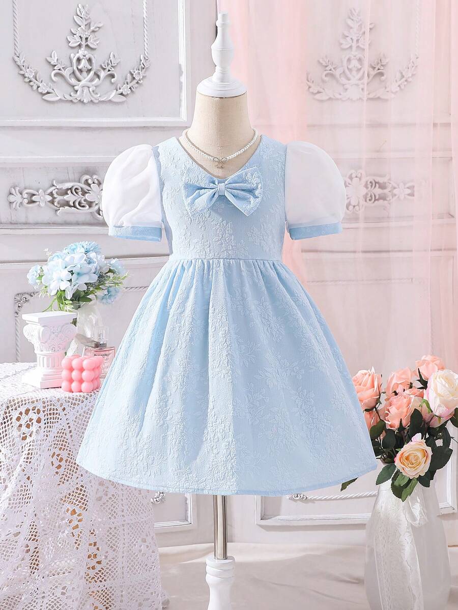 小女童前蝴蝶結泡泡袖洋裝