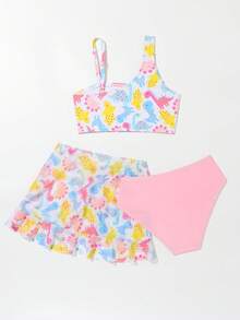 年轻女孩卡通图形比基尼套装与沙滩裙夏日海滩