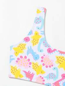 年轻女孩卡通图形比基尼套装与沙滩裙夏日海滩