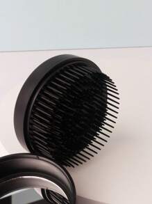 Peine portátil con espejo