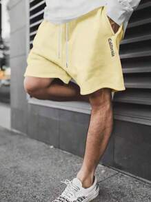 Manfinity Hypemode Men Letter Graphic Drawstring Waist Shorts - Yellow - View 1