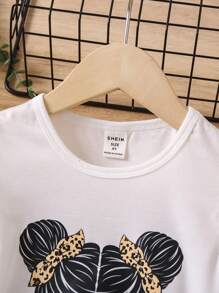 SHEIN Young Girl Figure Graphic Ruffle Trim Tee & Leopard Print Mesh Overlay Skirt Set