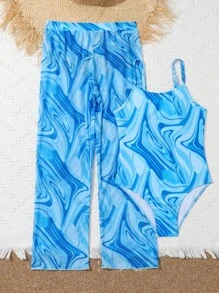 Chica preadolescente Bañador una pieza fluido con estampado con pantalones cover up