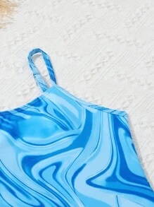 Chica preadolescente Bañador una pieza fluido con estampado con pantalones cover up