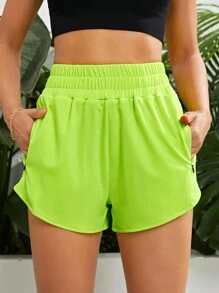 Yoga Basic 螢光綠斜口袋運動短褲