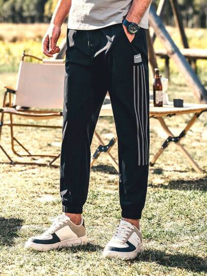 男士條紋印花斜口袋長褲