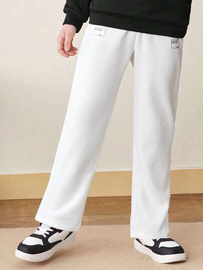 SHEIN Tween Boy休閒純色束口汗pants，配飾繡補