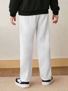 SHEIN Tween Boy休閒純色束口汗pants，配飾繡補