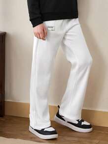 SHEIN Tween Boy休閒純色束口汗pants，配飾繡補