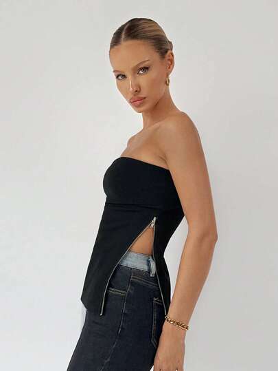 Maija 1 st ärmlös svart topp med dragkedja i sidan och delad fåll för kvinnor