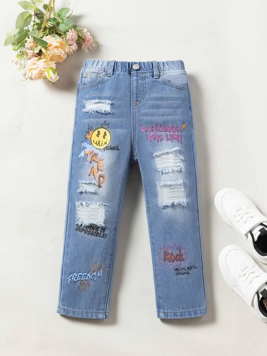 SHEIN Young Girl Cartoon & Letter Graphic Ripped Jeans - Light Wash - View 1