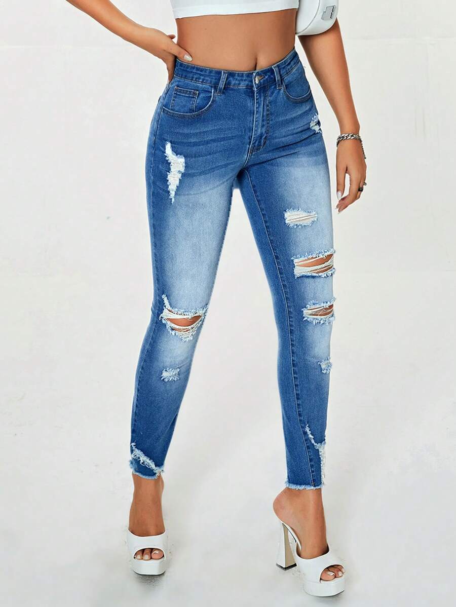 SHEIN Essnce 破洞毛邊緊身牛仔褲 - 中等水洗藍 - 查看 1